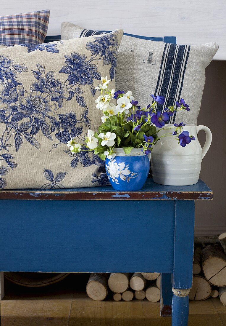 Blue bench with pillows in country style