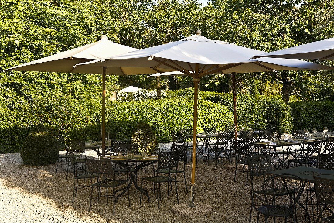 'Sunny mood' on a restaurant terrace with patio furniture and sun umbrellas