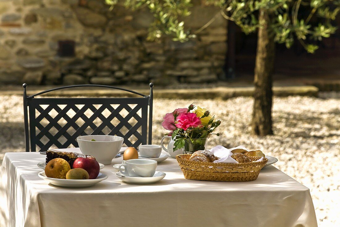 A garden table laid for breakfast
