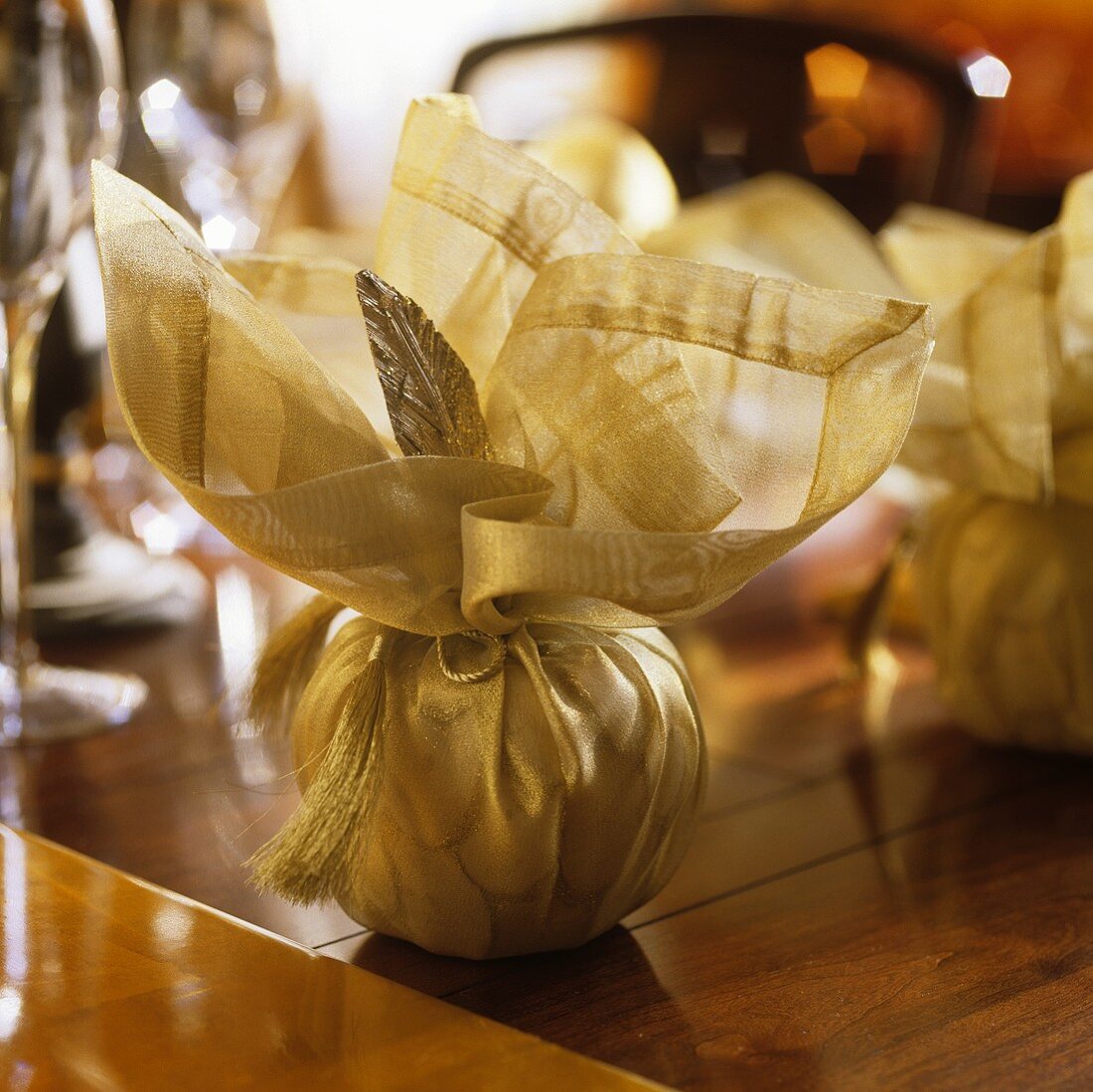 Christmas decorations wrapped in golden fabric
