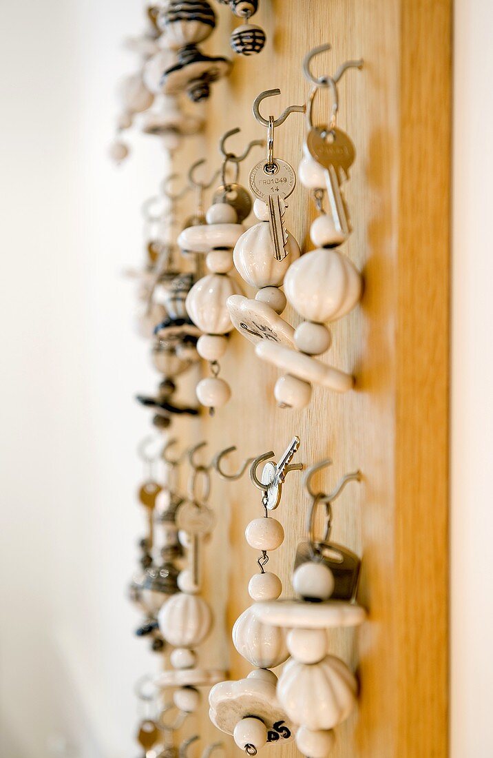 A keyboard in a hotel - porcelain beads strung together as keyrings