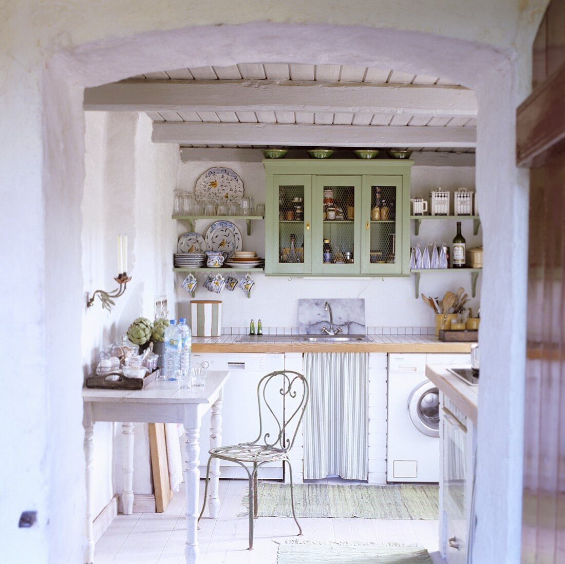 A kitchen in a 19th century German thatched-roof house decorated in a Scandinavian style