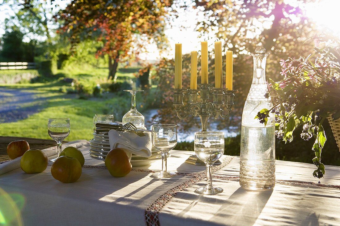 A table laid in the sunshine for a picnic