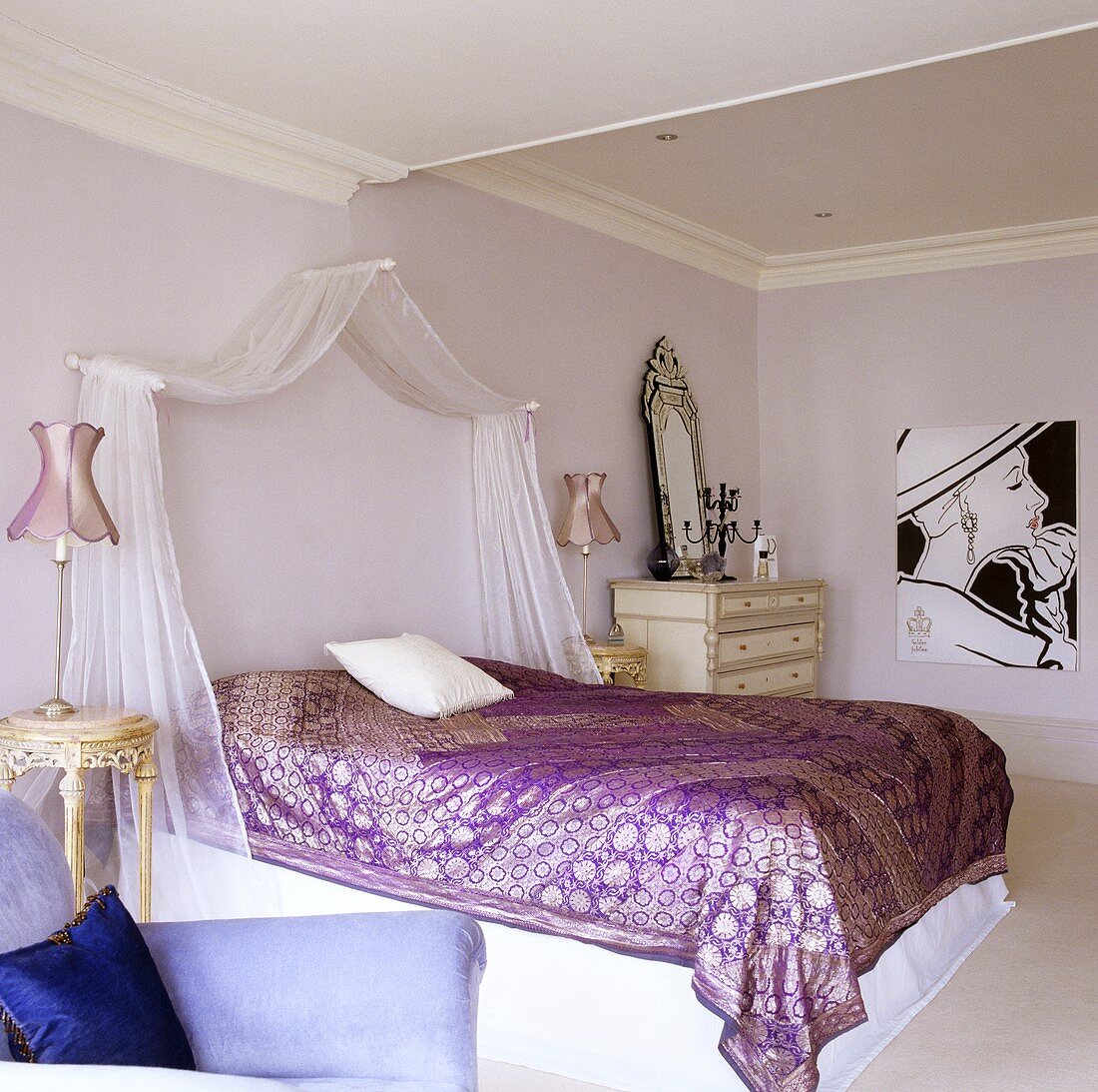 An Oriental bedroom - a light canopy above a shimmering metallic throw