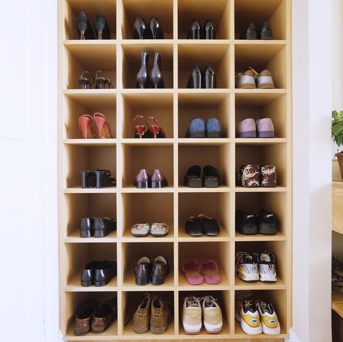 A shoe shelf built into a wall niche