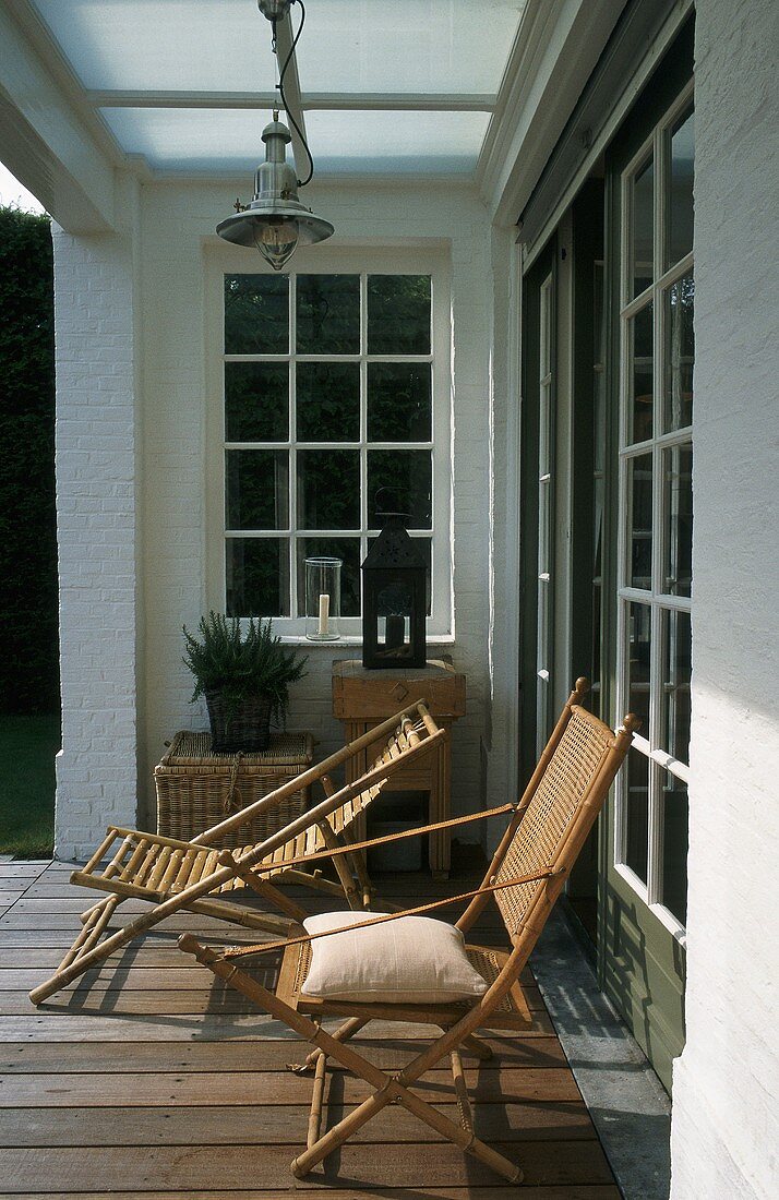 A sunny spot on a terrace with wooden loungers