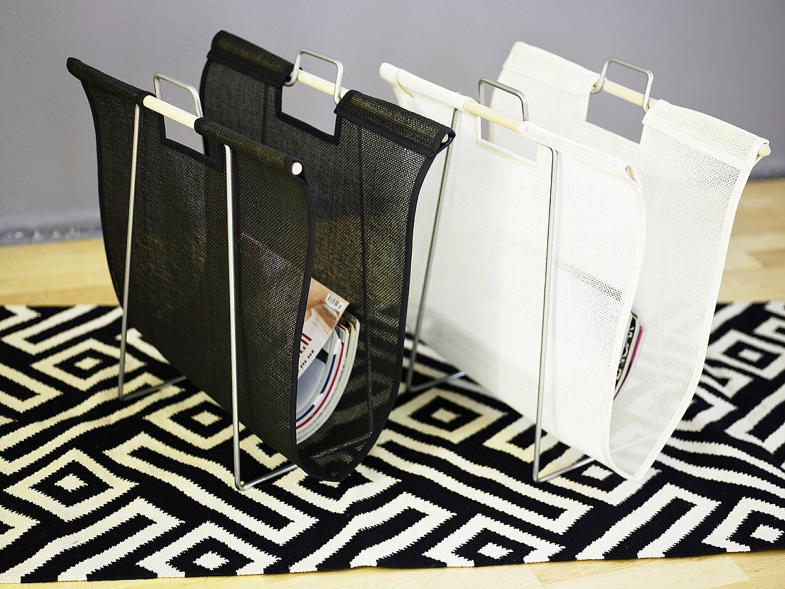 Black and white magazine racks on a black and white patterned carpet