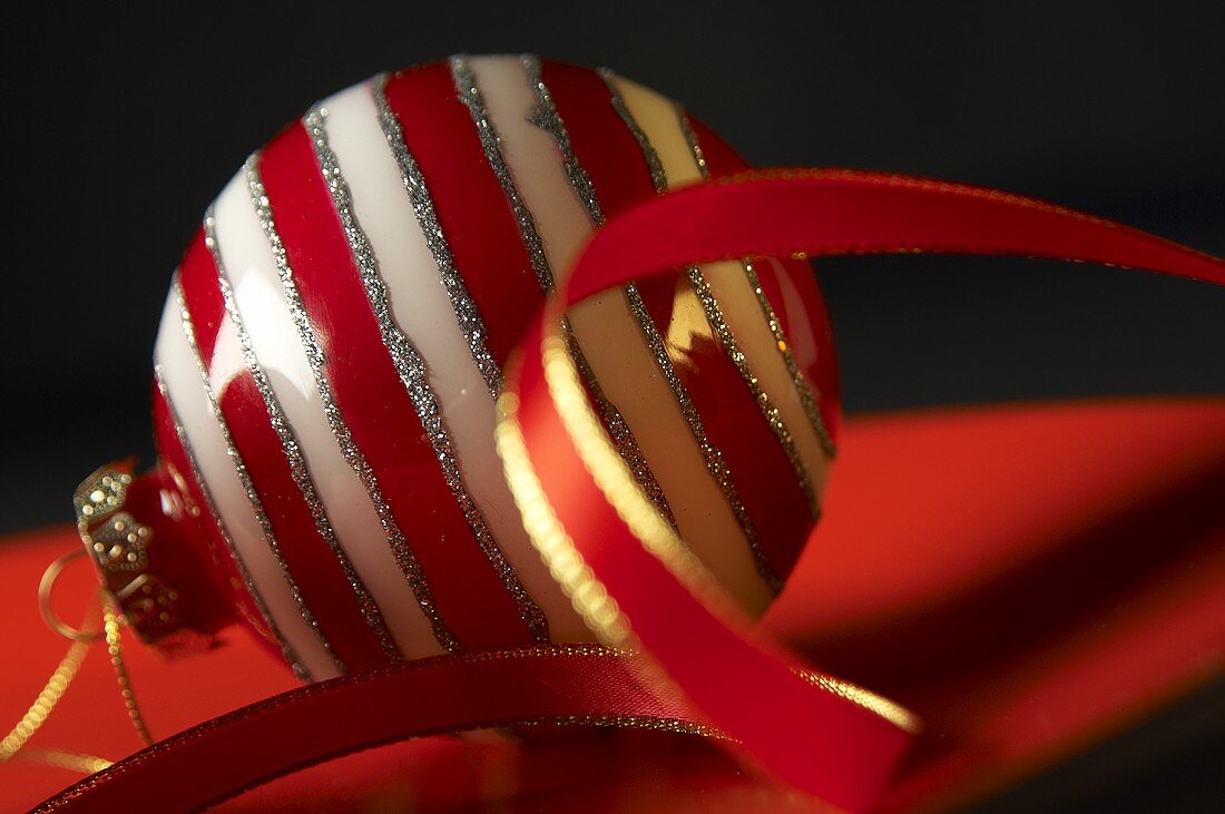 Red and white striped Christmas baubles with ribbon
