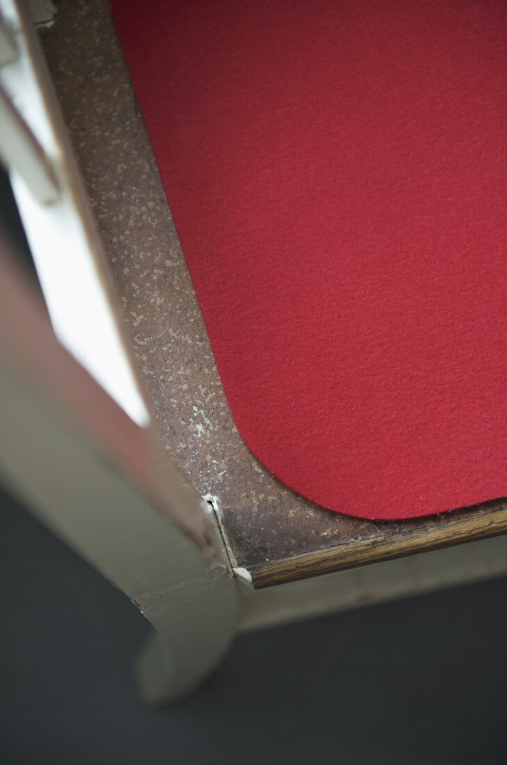 Red seat mat on wooden chair