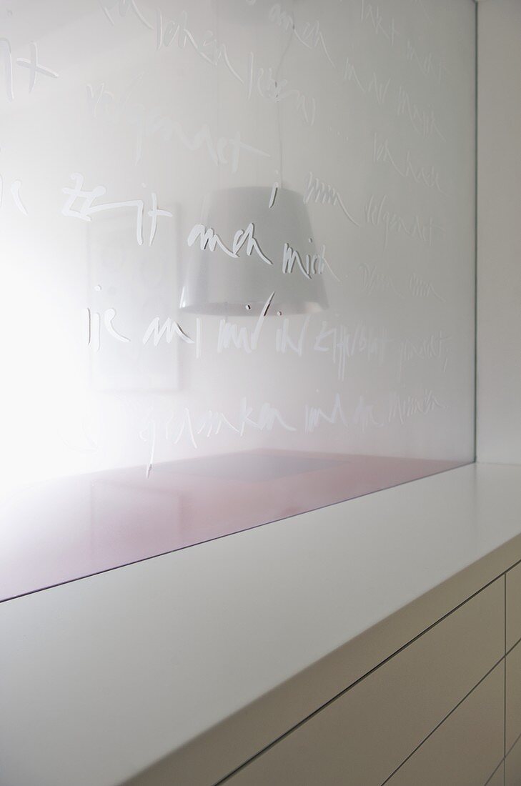 Lettering embossed in frosted glass screen