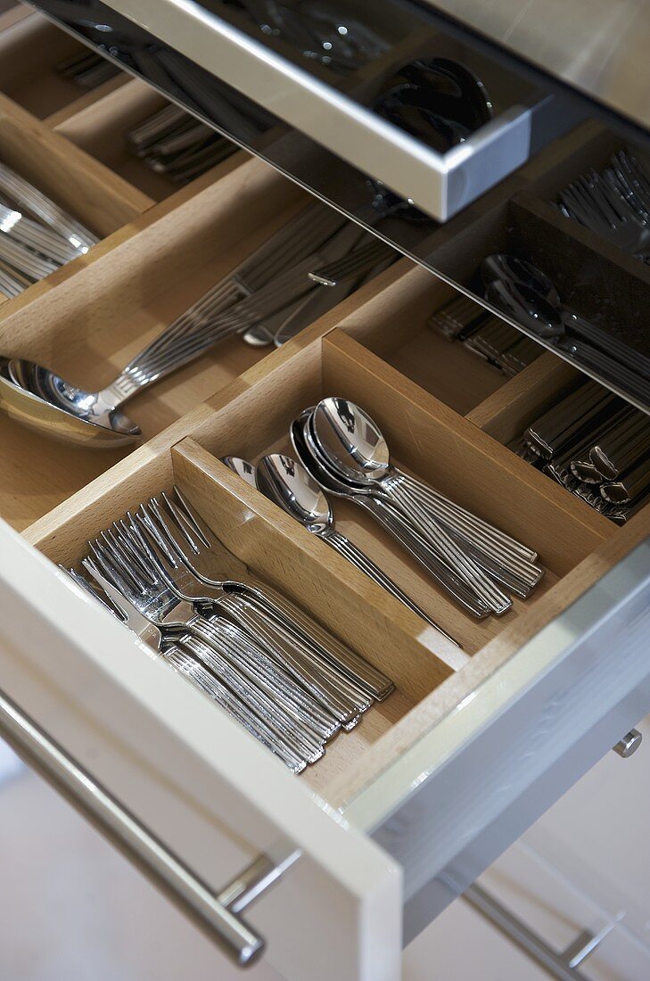 Cutlery drawer in white fitted unit