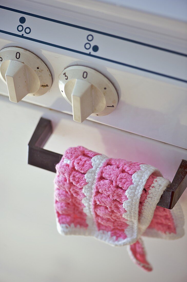Crochet cloth over handle of oven