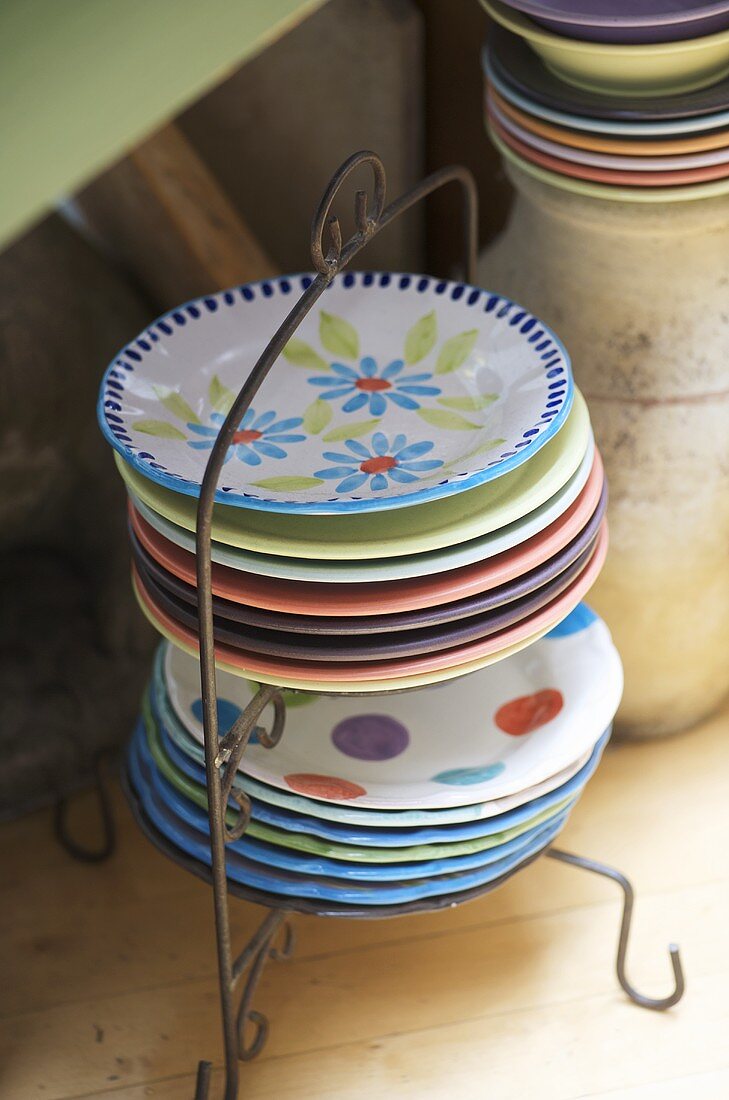 Colourful plates in metal stand