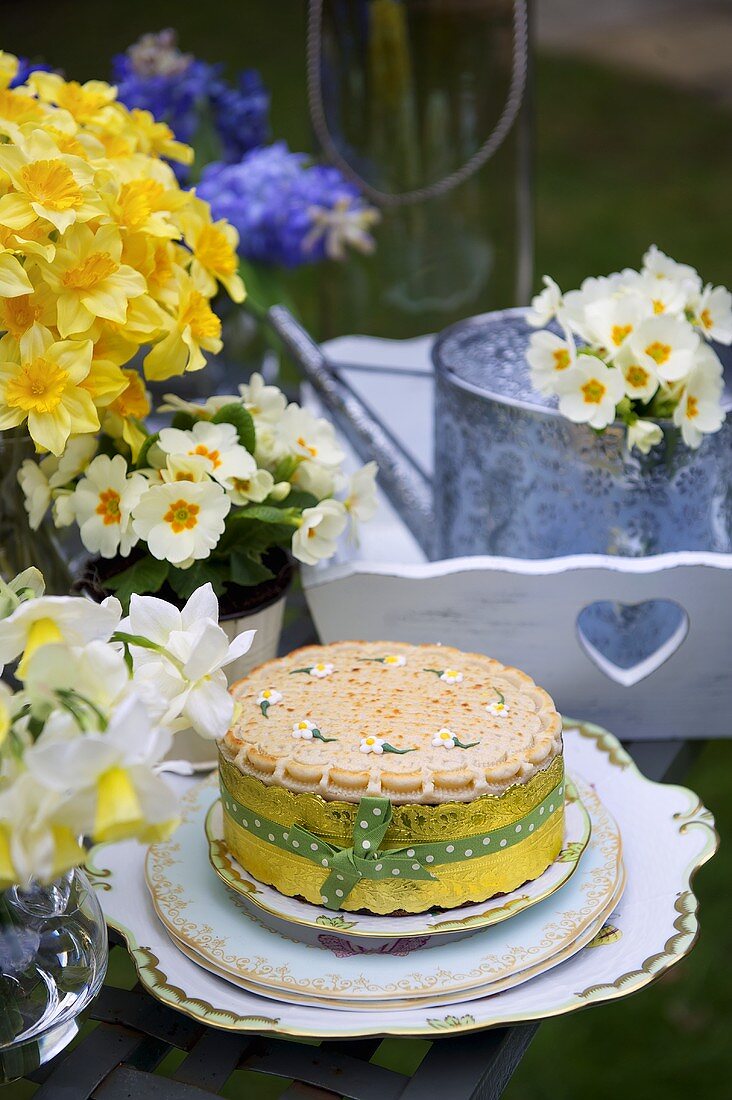 A decorated cake and spring flowers