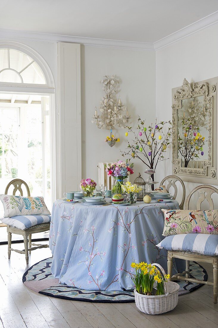 Spring flowers and Easter eggs on table