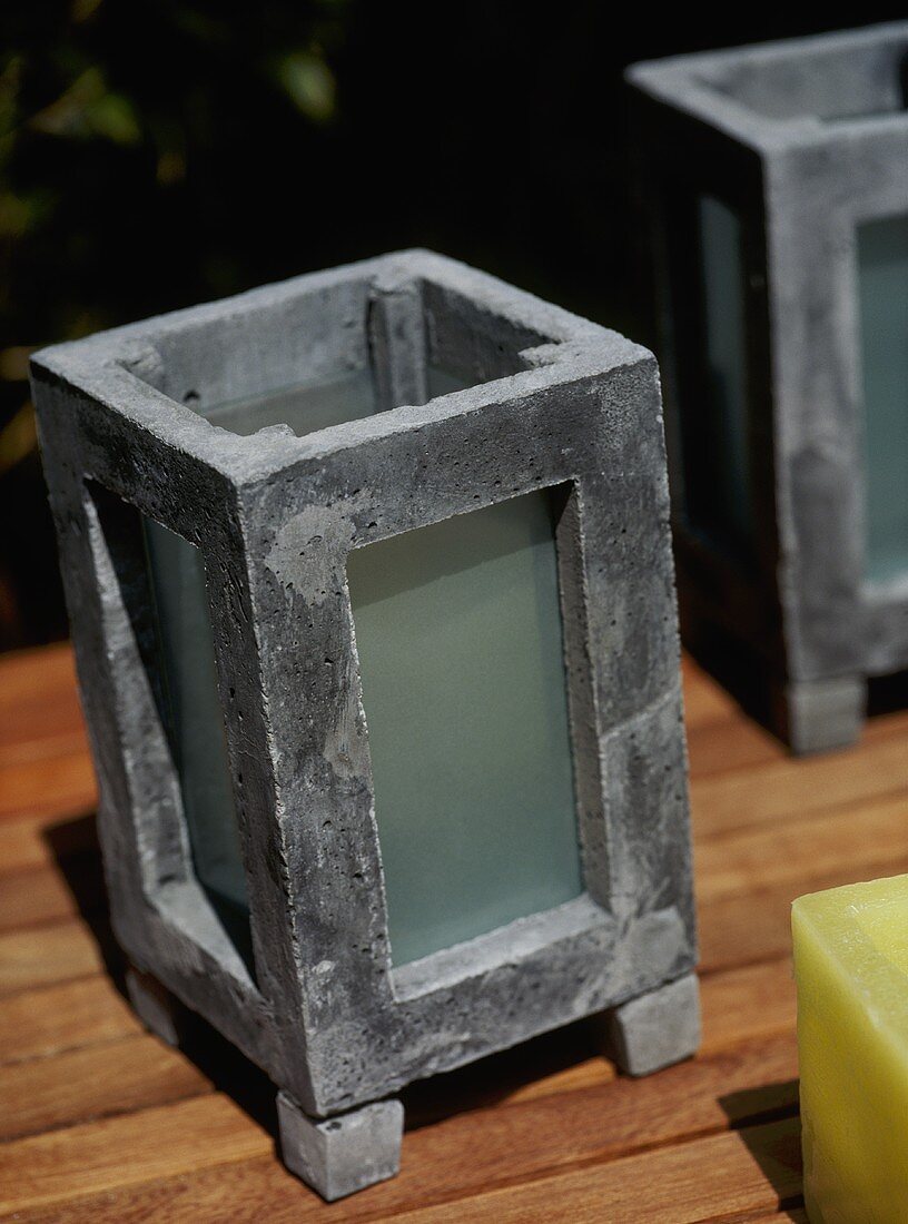 A detail of stone and glass candle holders for use outside