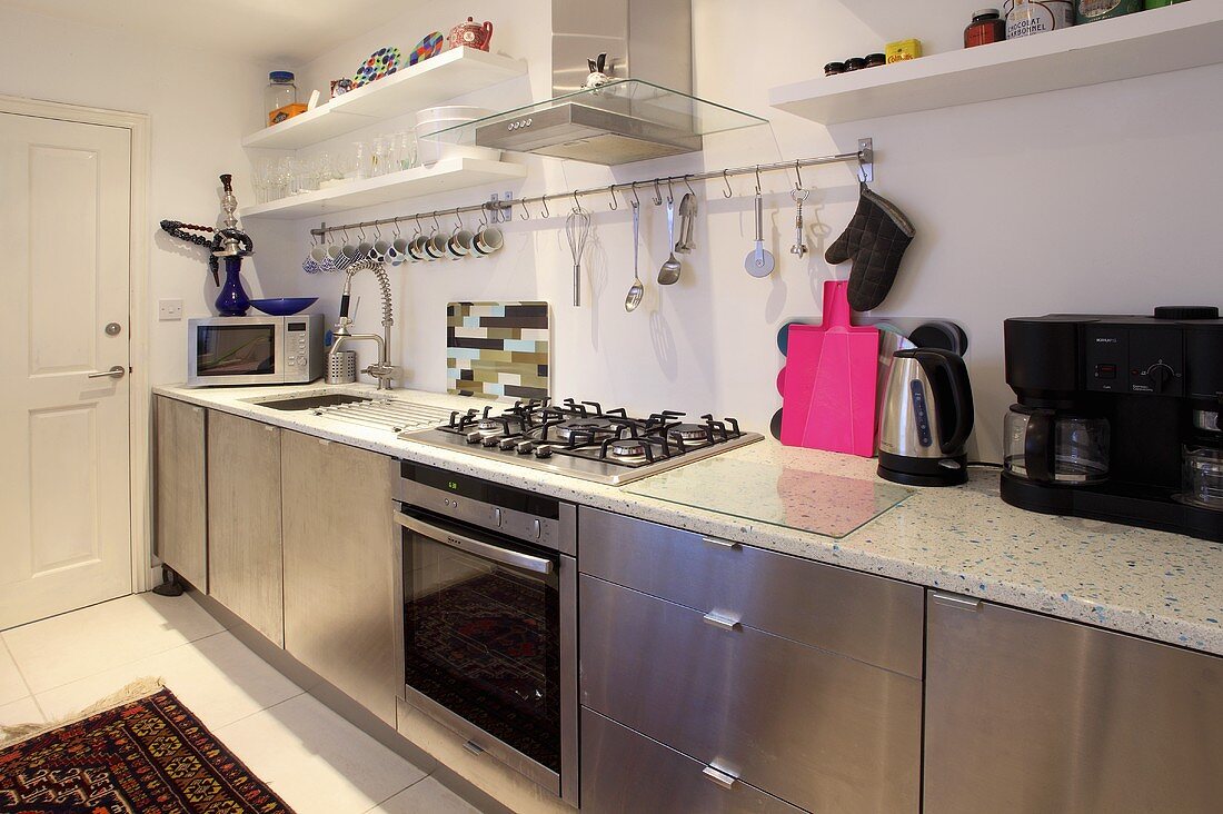 A kitchen with stainless steel cupboards
