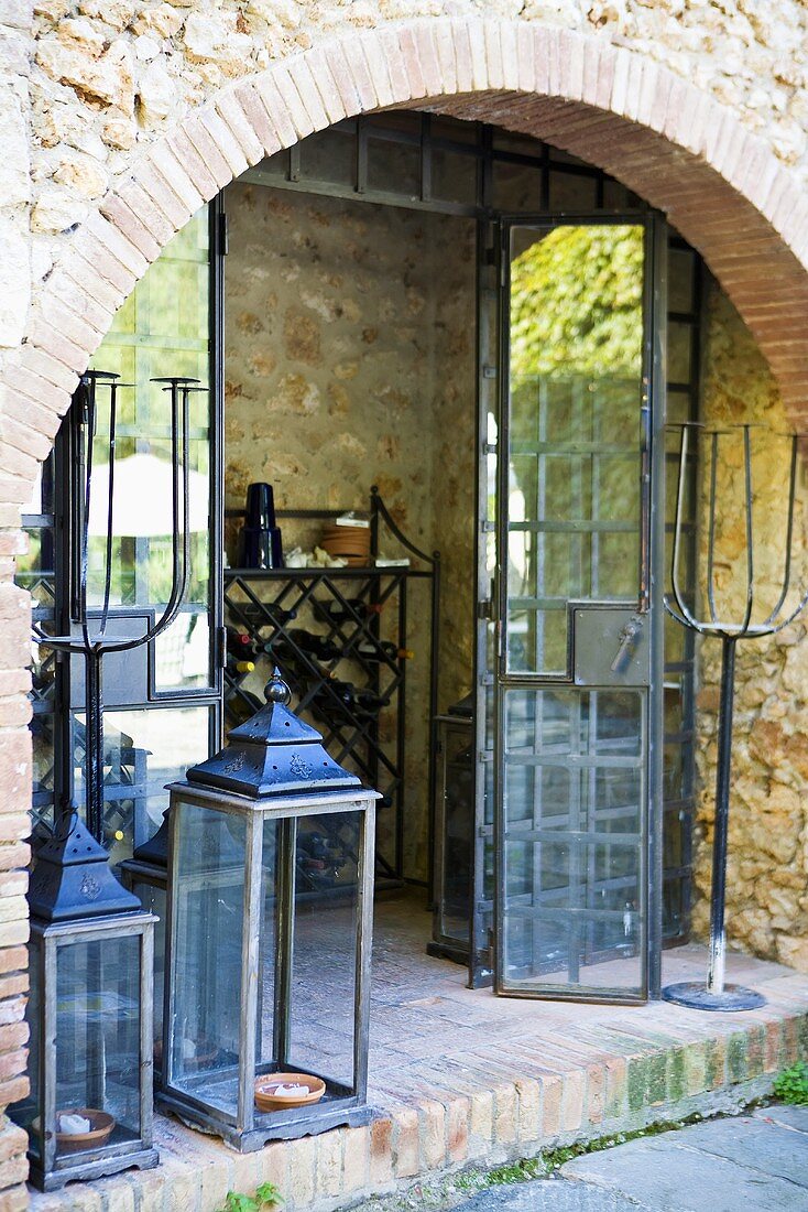 Foyer with glass folding doors and lanterns