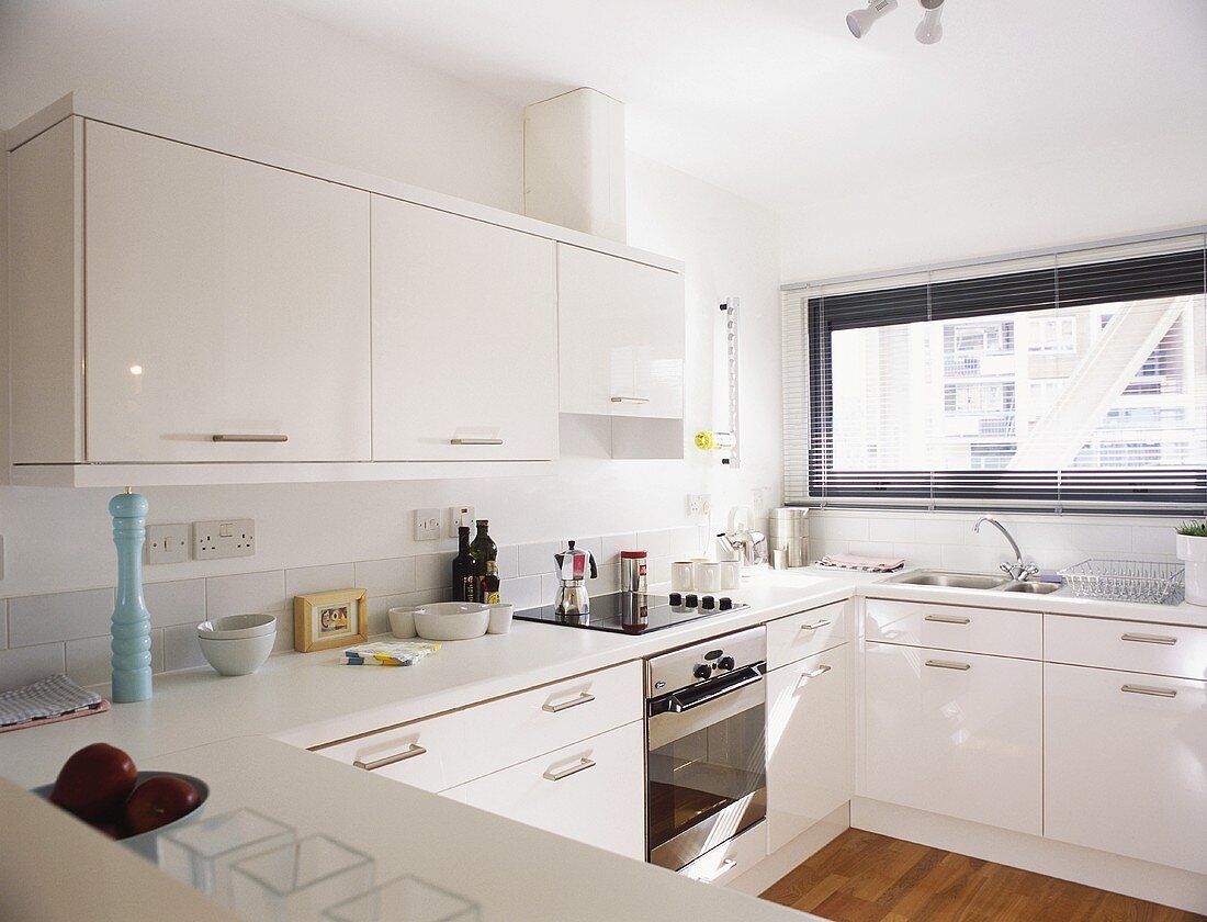 A modern kitchen with white cupboards