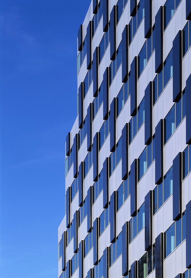 A facade of a multi-storey, newly built building