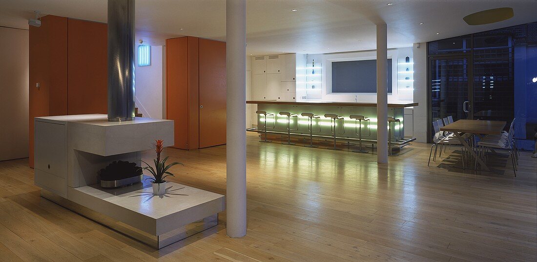 Concrete pillars in a designer living room-cum-kitchen