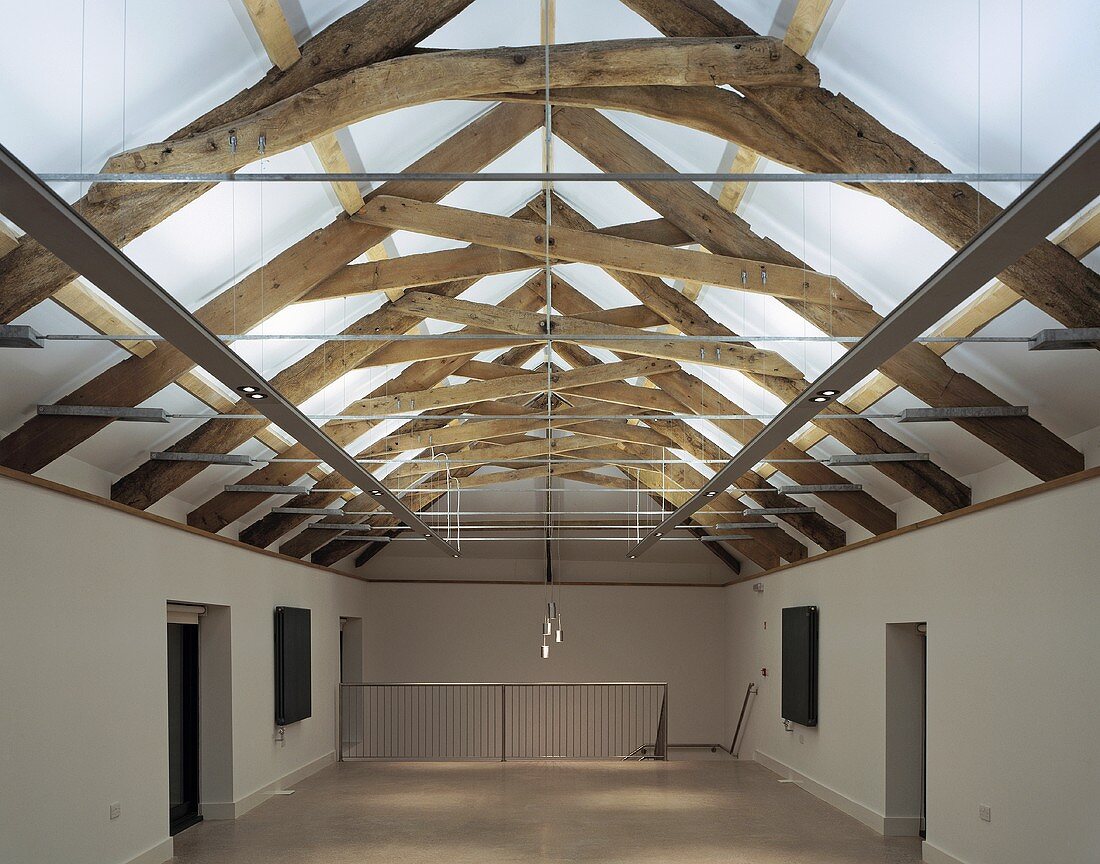 A converted barn with a wood beam ceiling