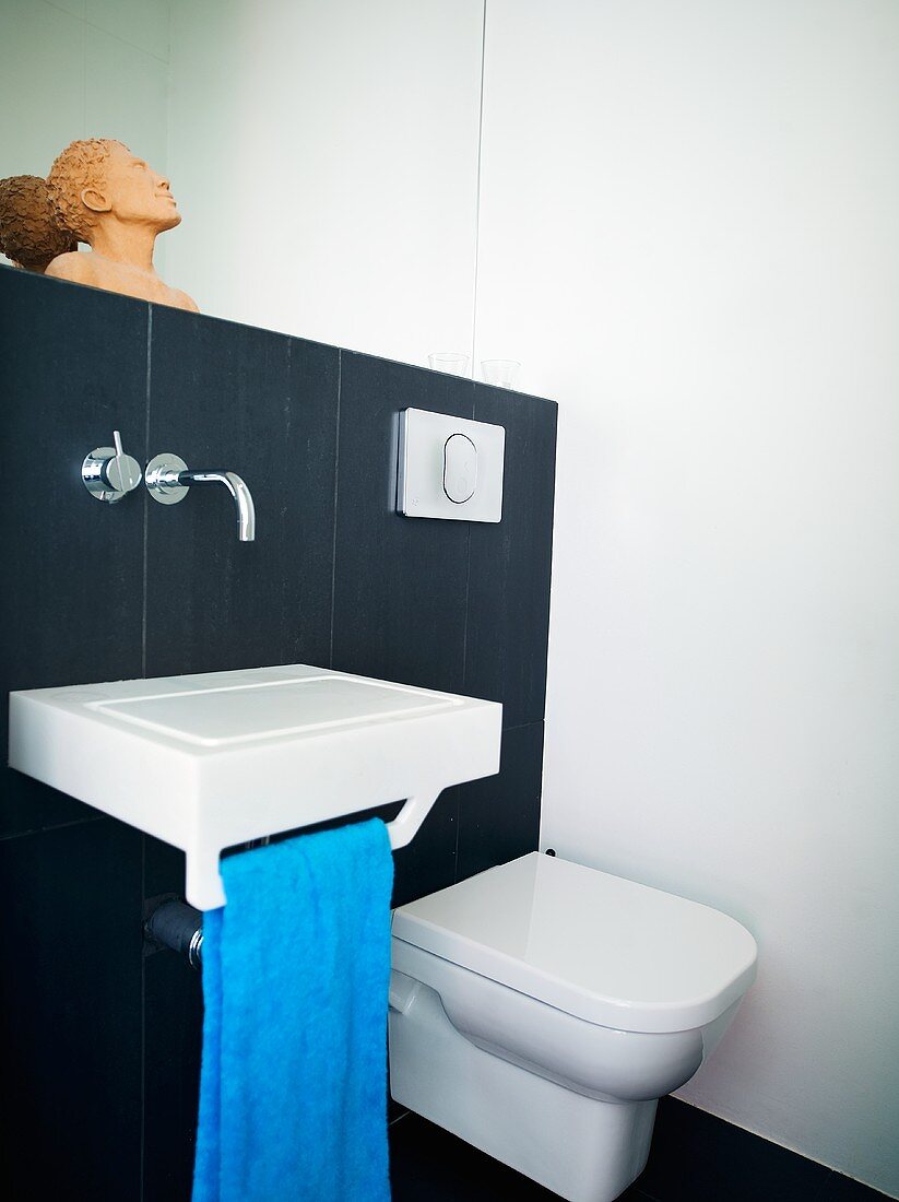 A designer wash basin next to a toilet