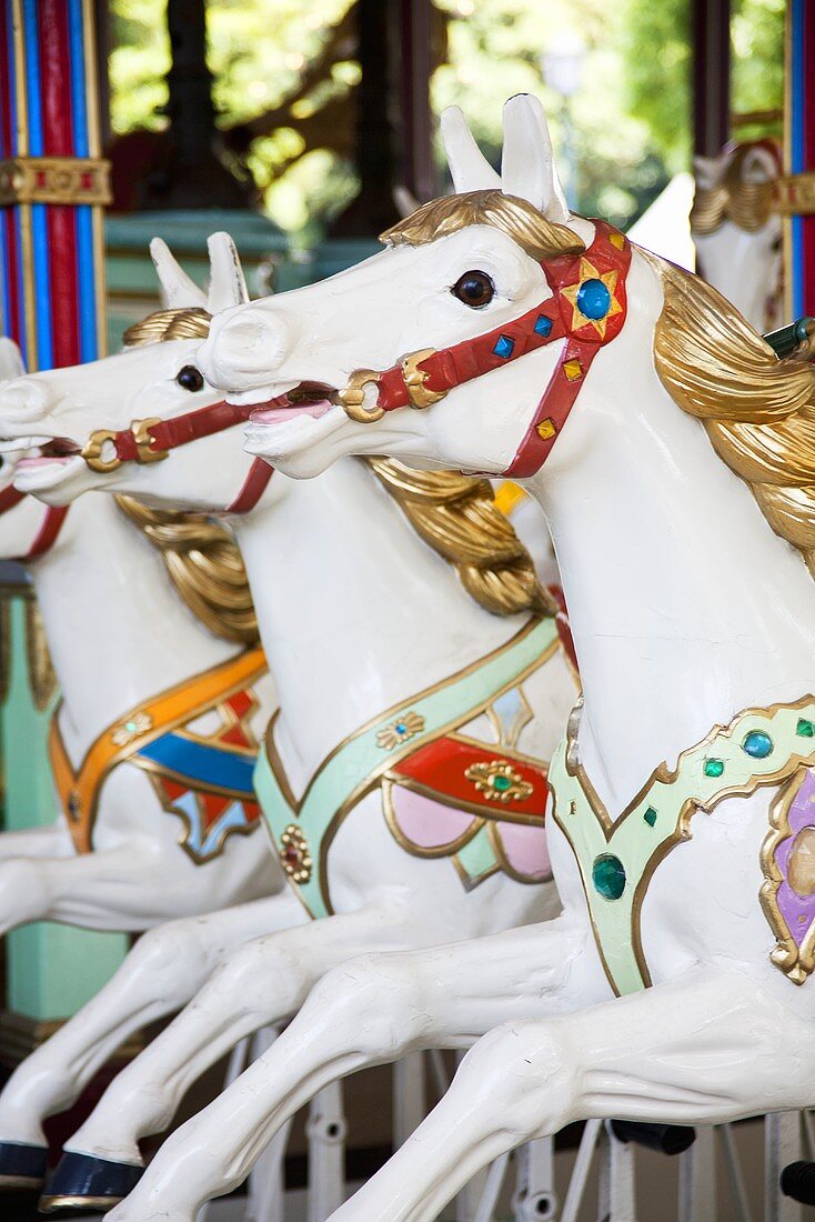 An old fashioned children's carousel with horses
