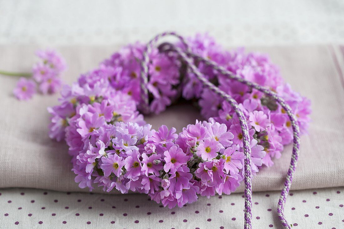 A wreath of purple baby primroses