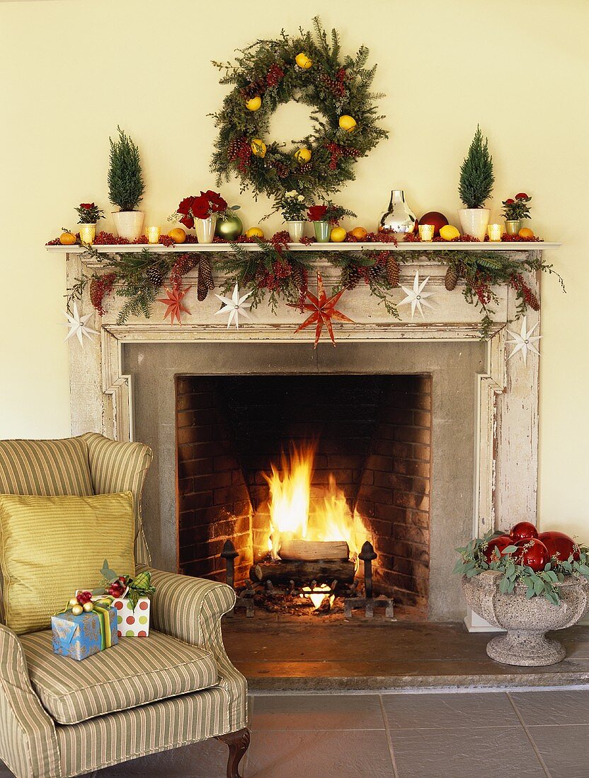 Open fireplace with Christmas decorations in living room