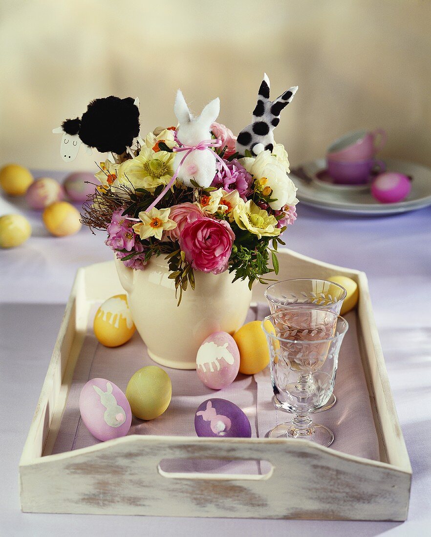 Tray with vase of Easter flowers and Easter eggs
