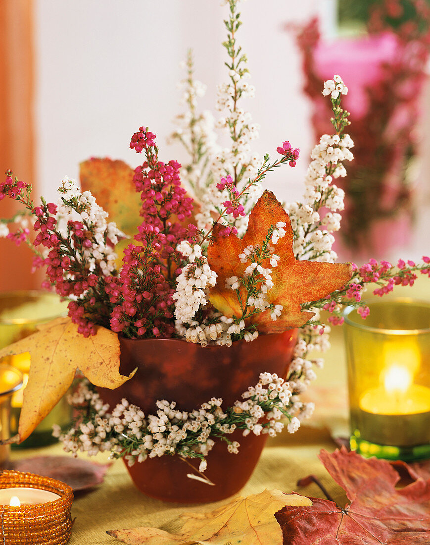 Arrangement of heather and autumn leaves