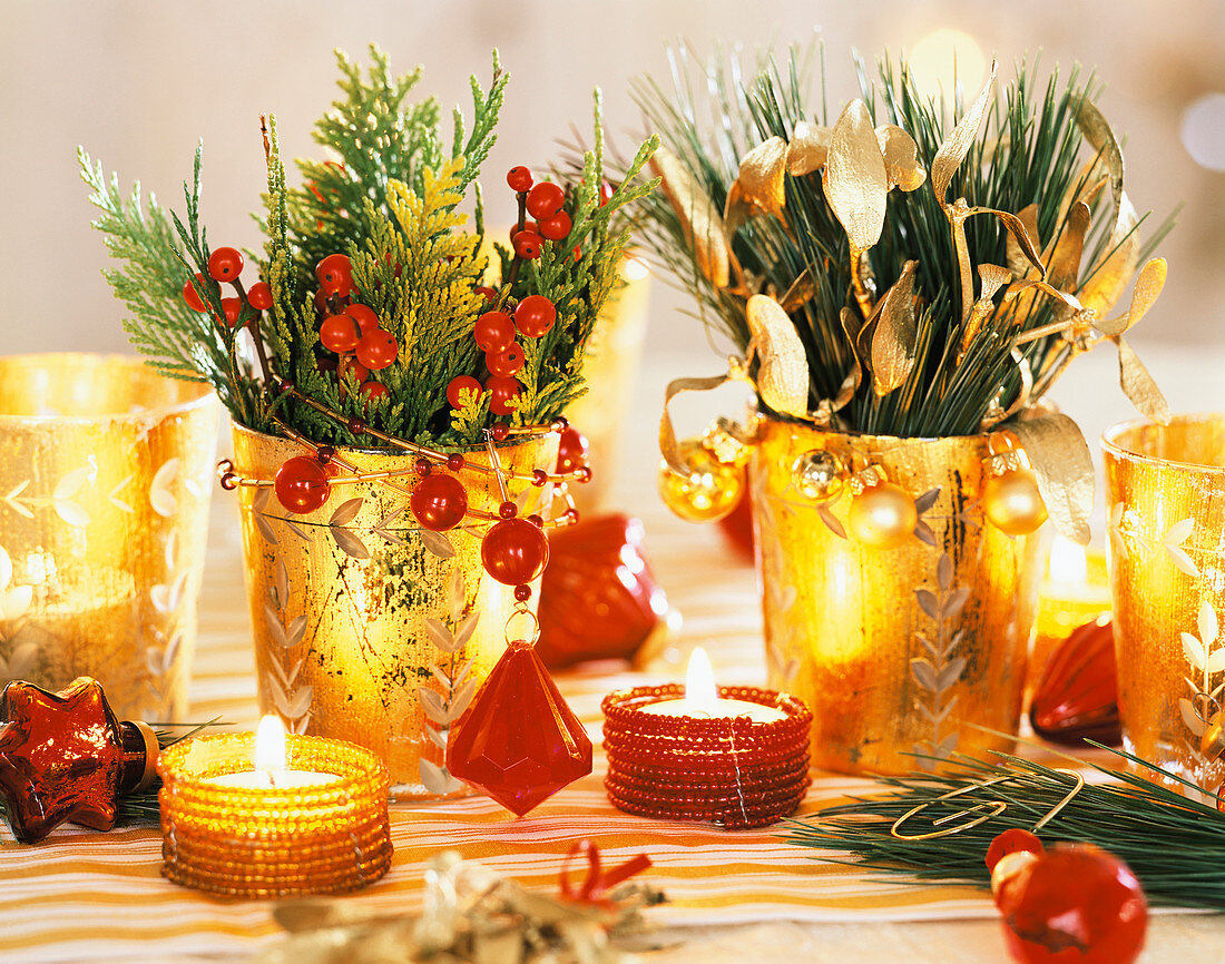 Golden glasses with false cypress and red berries