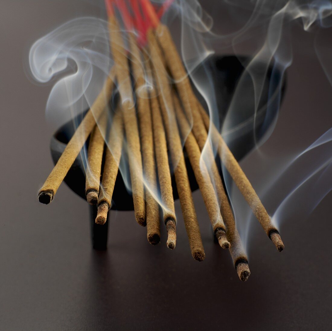 Incense sticks in dish