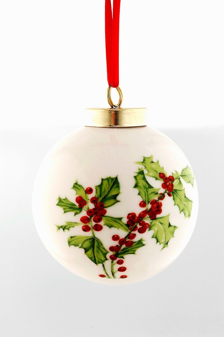 White Christmas bauble with holly motif