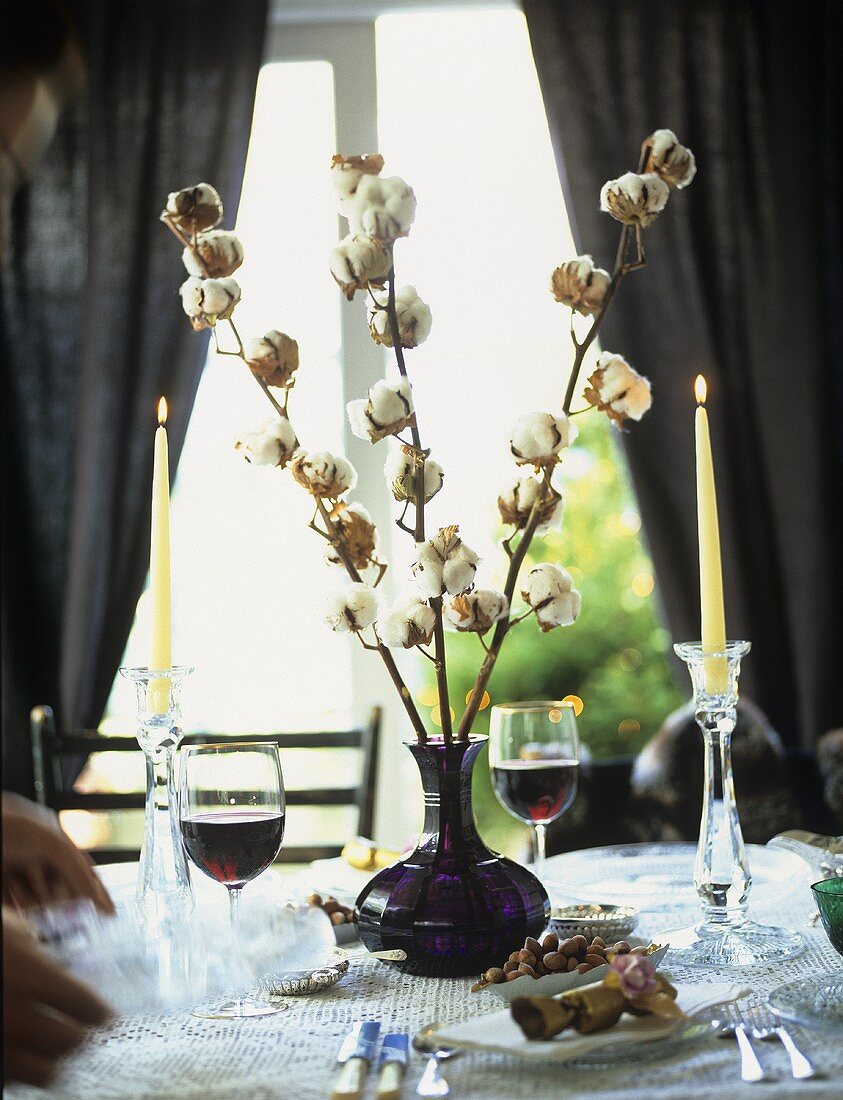 Elegantly laid table with red wine