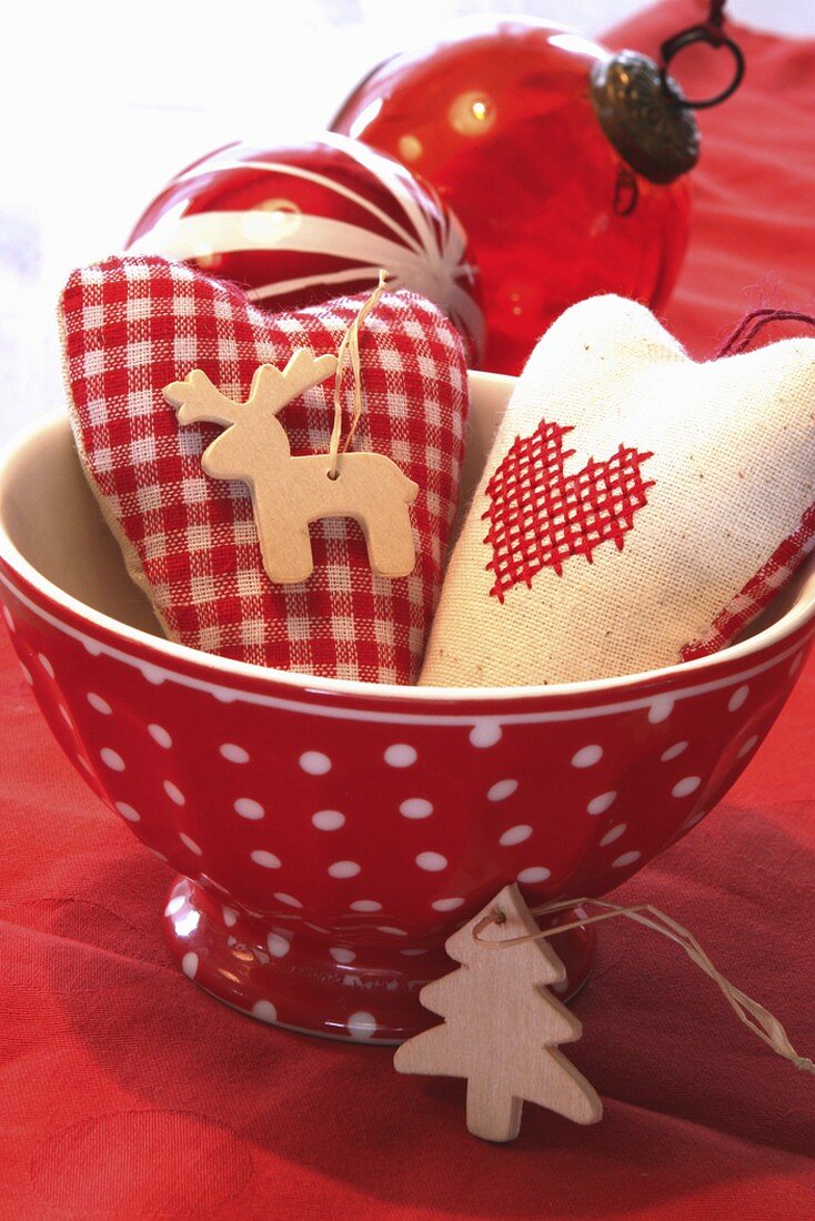 Xmas decorations: fabric hearts, wooden tree ornaments, baubles