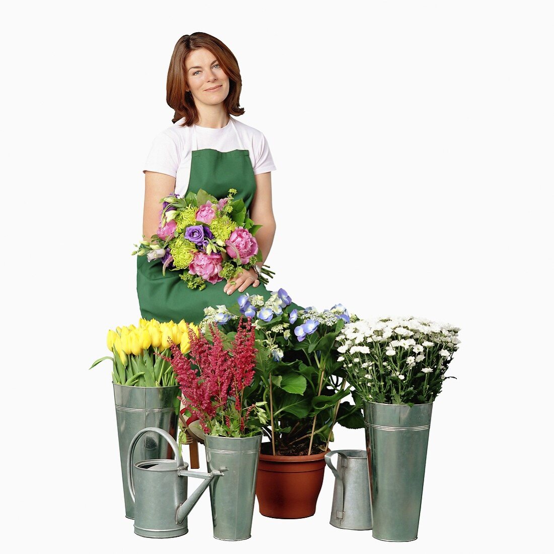 A gardner with various types of cut flowers