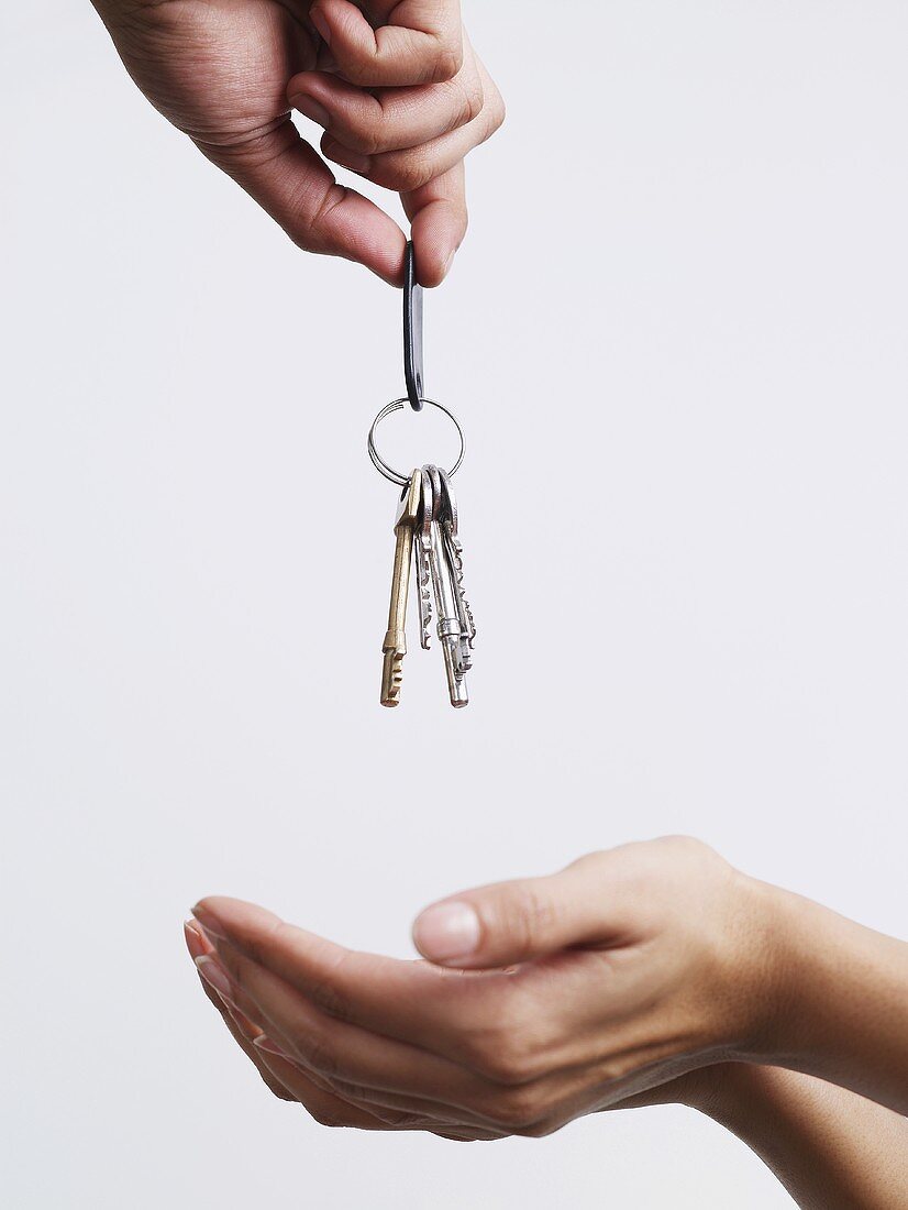 A man and a woman being given keys