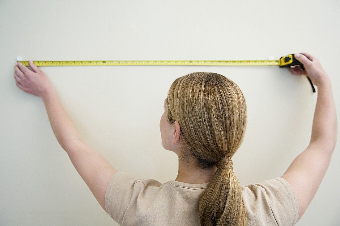 A woman with a measuring tape