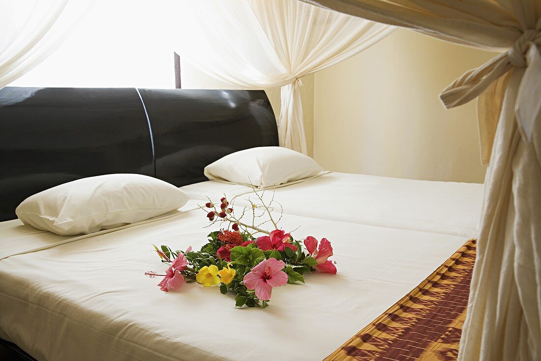 Flowers on a double bed