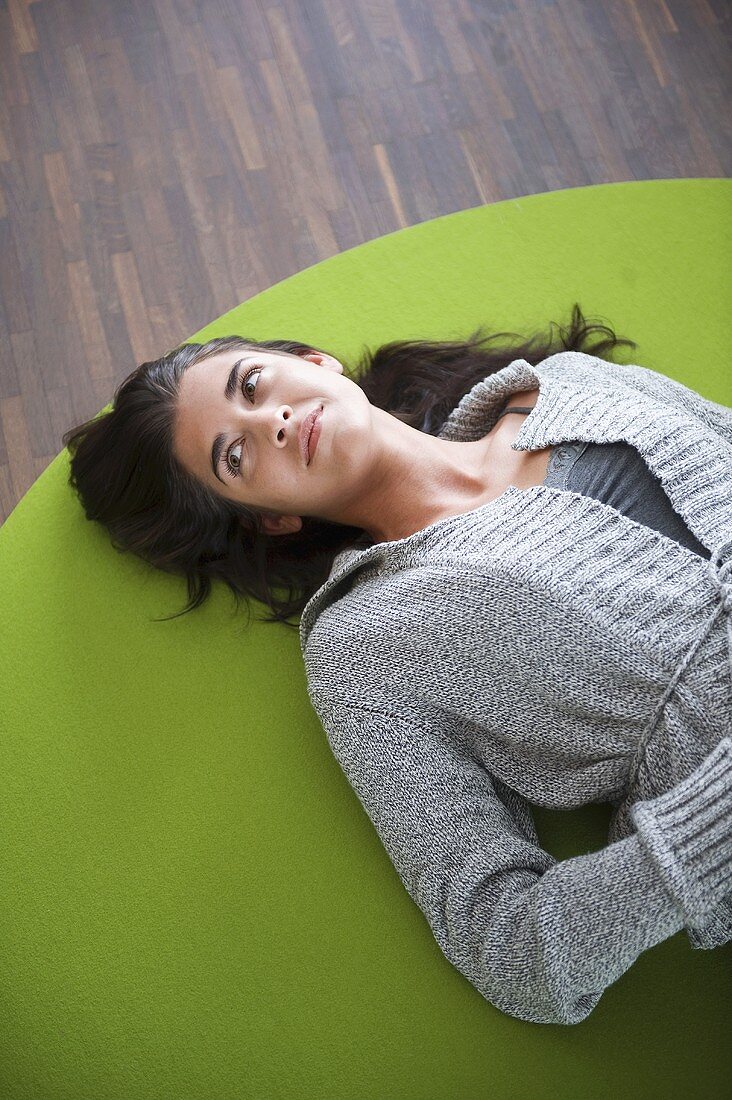 Young woman lying on floor
