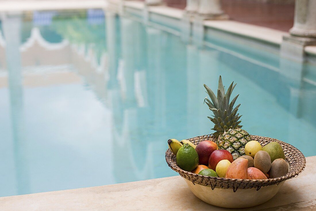 Fruit by a swimming pool