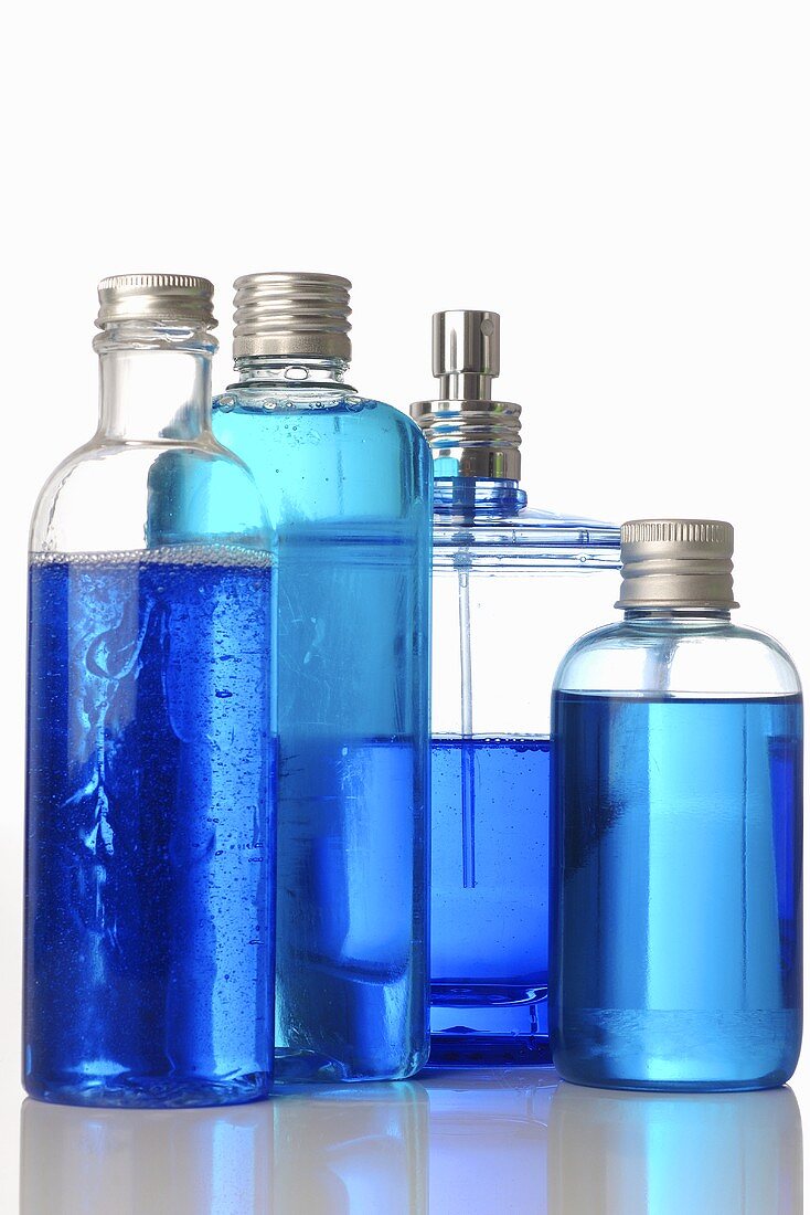 Four cosmetic bottles