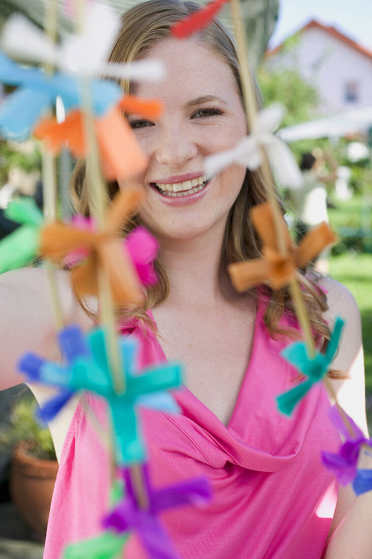 Woman with coloured garlands for a garden party