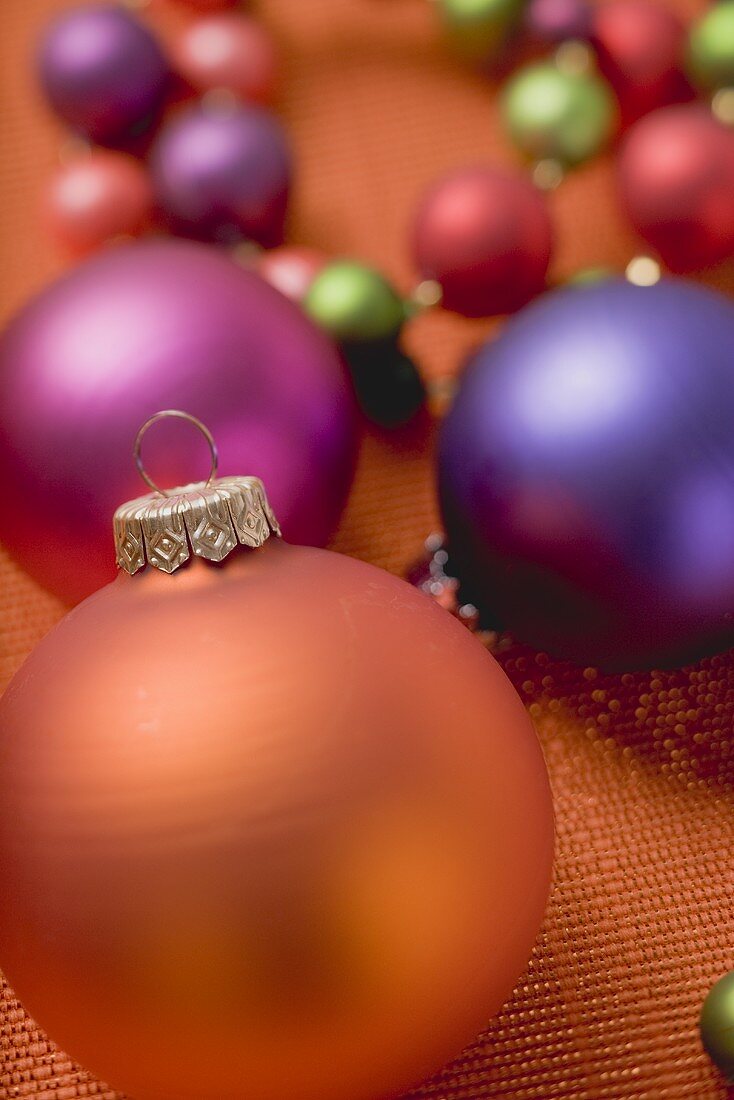 Coloured Christmas baubles of various sizes