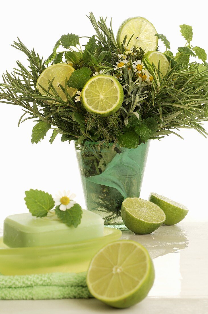 Bouquet of herbs and lime slices for wellness