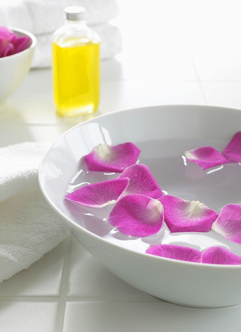 Rose petals floating in a bowl