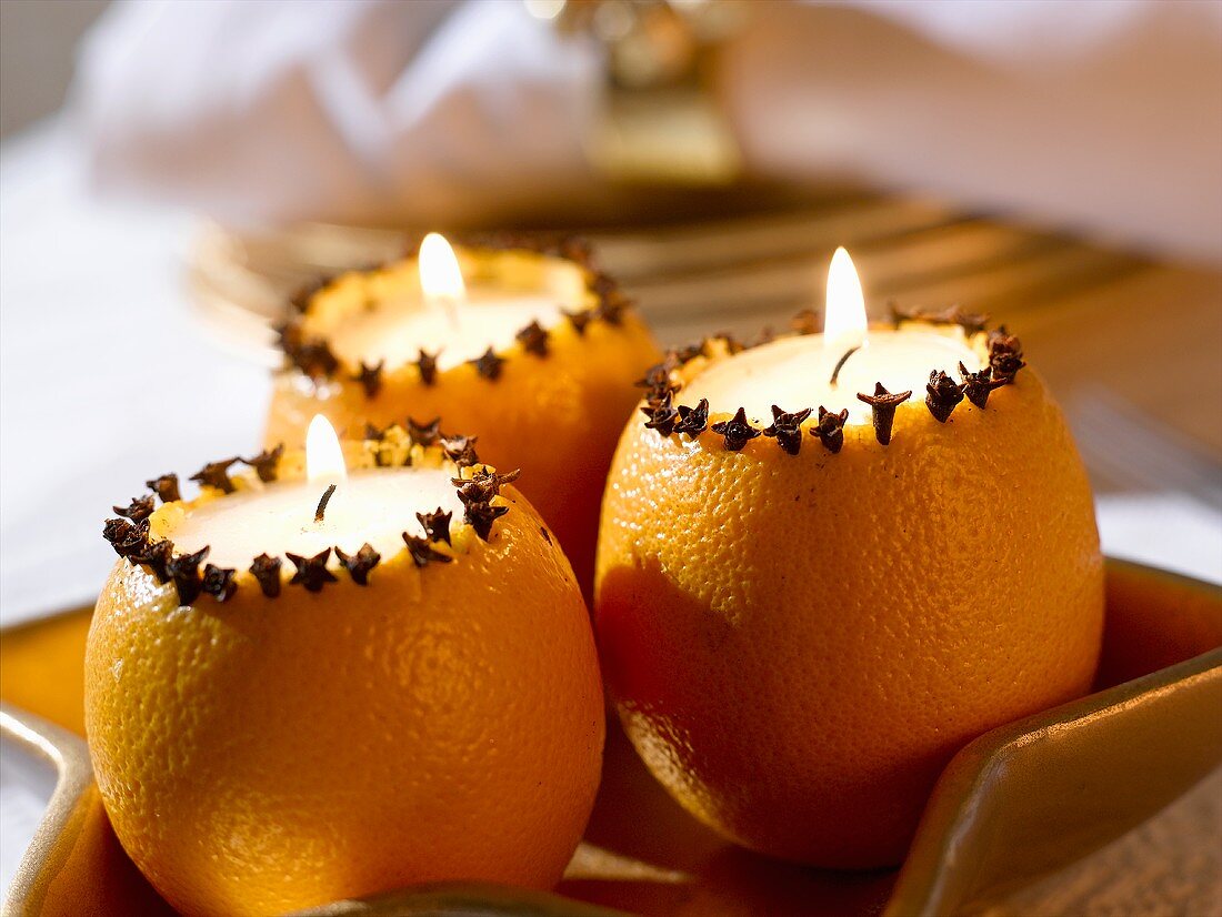 Orange candles with cloves