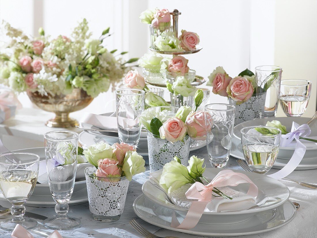 Romantic table with roses and lisianthus